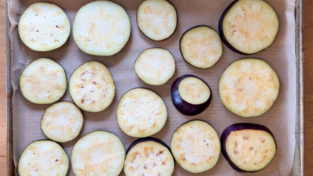 Eggplant slices on baking sheet